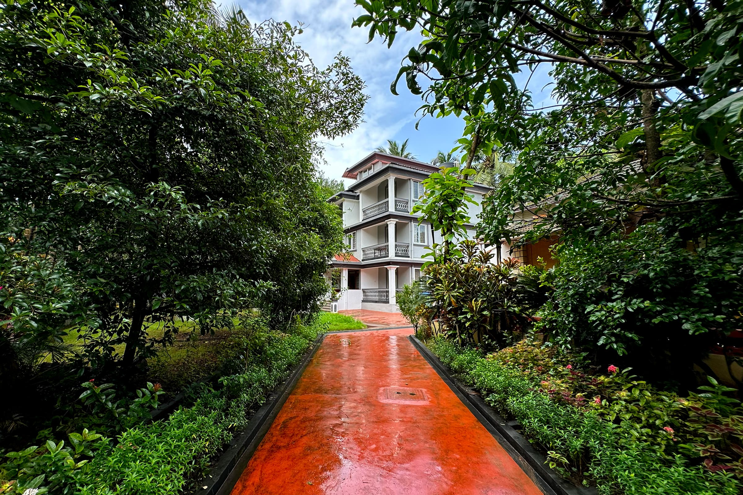 A garden path leading to a Misquita stay in Benaulim, South Goa.