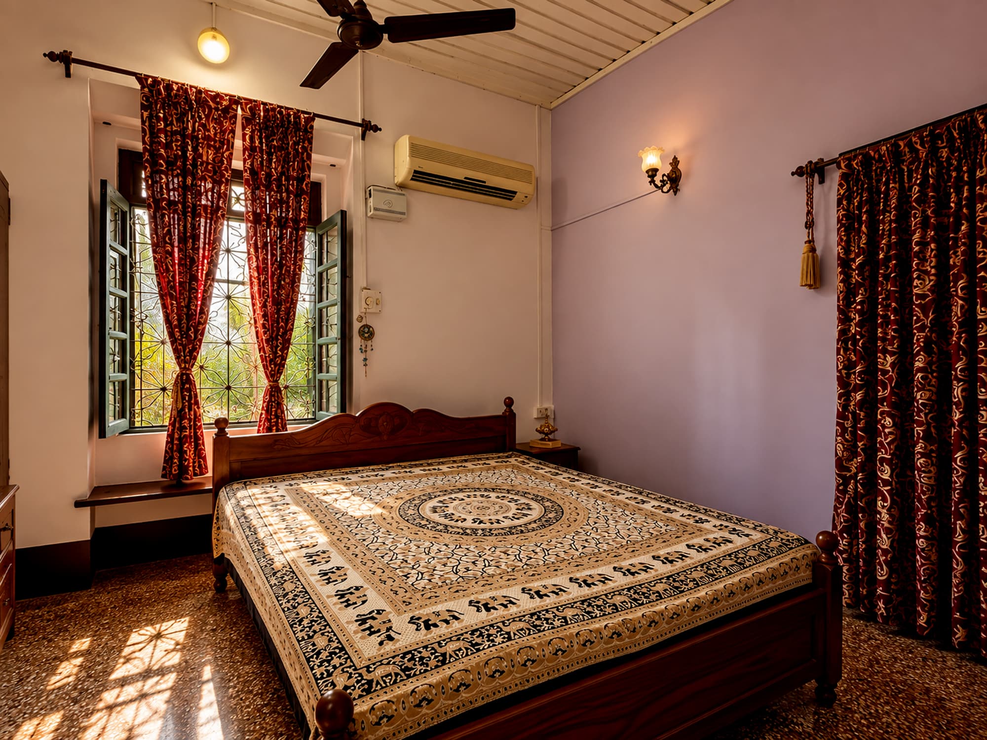 A third bedroom at Misquita Heritage with antique Italian floor tiles.