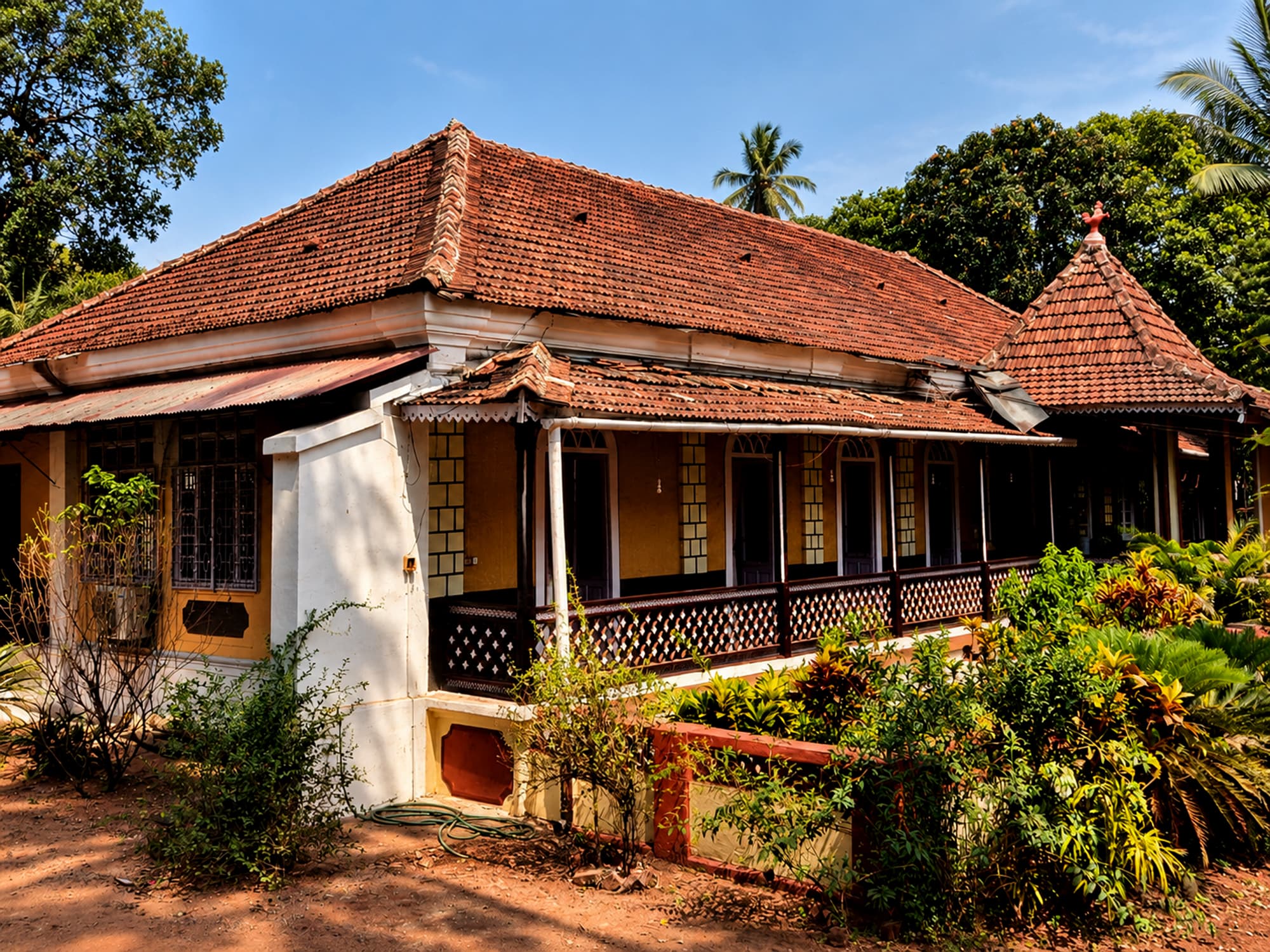 Misquita Heritage Homestay in Benaulim, an antique Goan home under a high tiled roof.